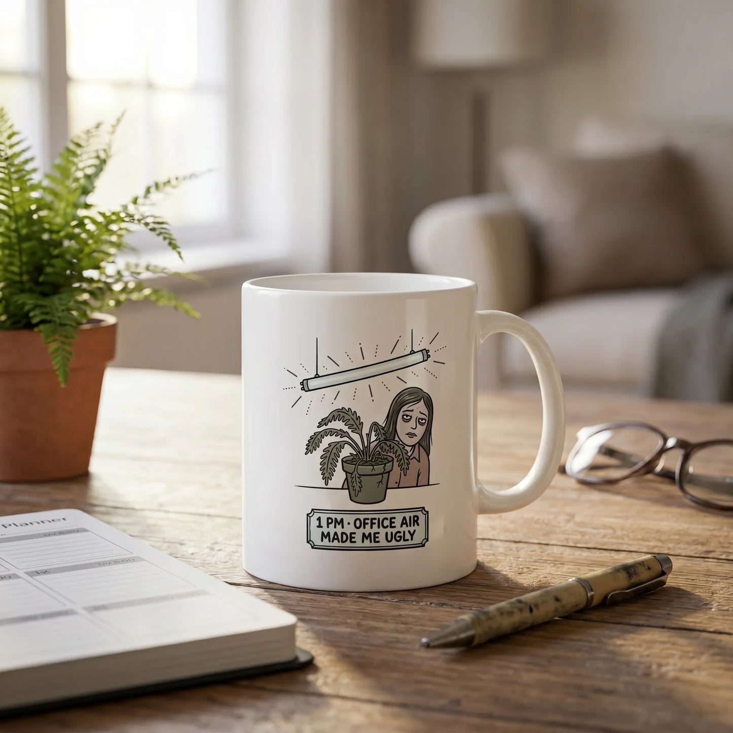 Lifestyle shot of the Office Air Theory Mug on a standup table, a funny 11oz ceramic gift for corporate refugees featuring the 9 AM vs 1 PM wilted desk fern meme.