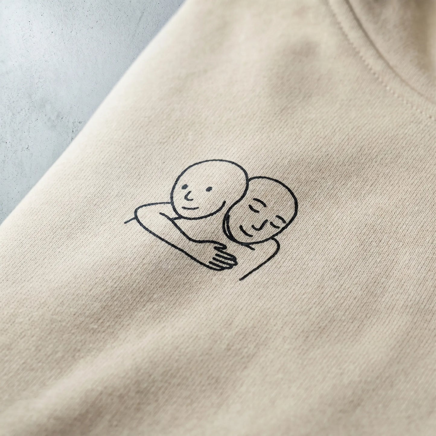 Detailed close-up of the soft-hand DTG print on the left-chest of a Wojak hoodie, showcasing the durable cotton polyester blend fabric and print quality that won't crack, available in sizes S–5XL.