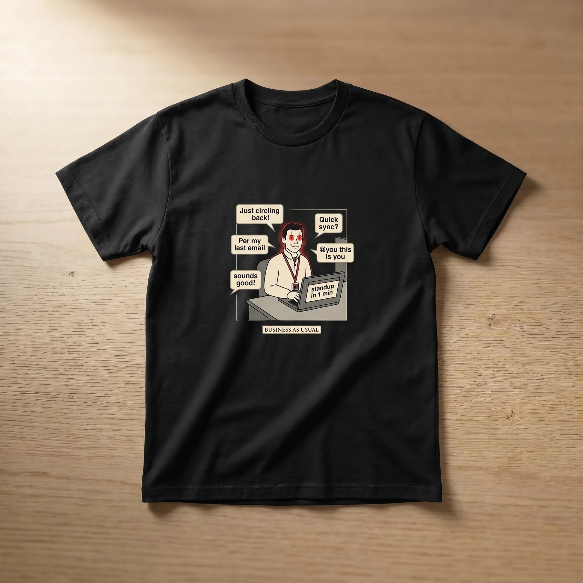 Front view of the Corporate NPC Tee featuring a funny office burnout print of a deadpan worker with glowing red eyes and jargon bubbles like Per My Last Email and Just circling back for workplace humor.