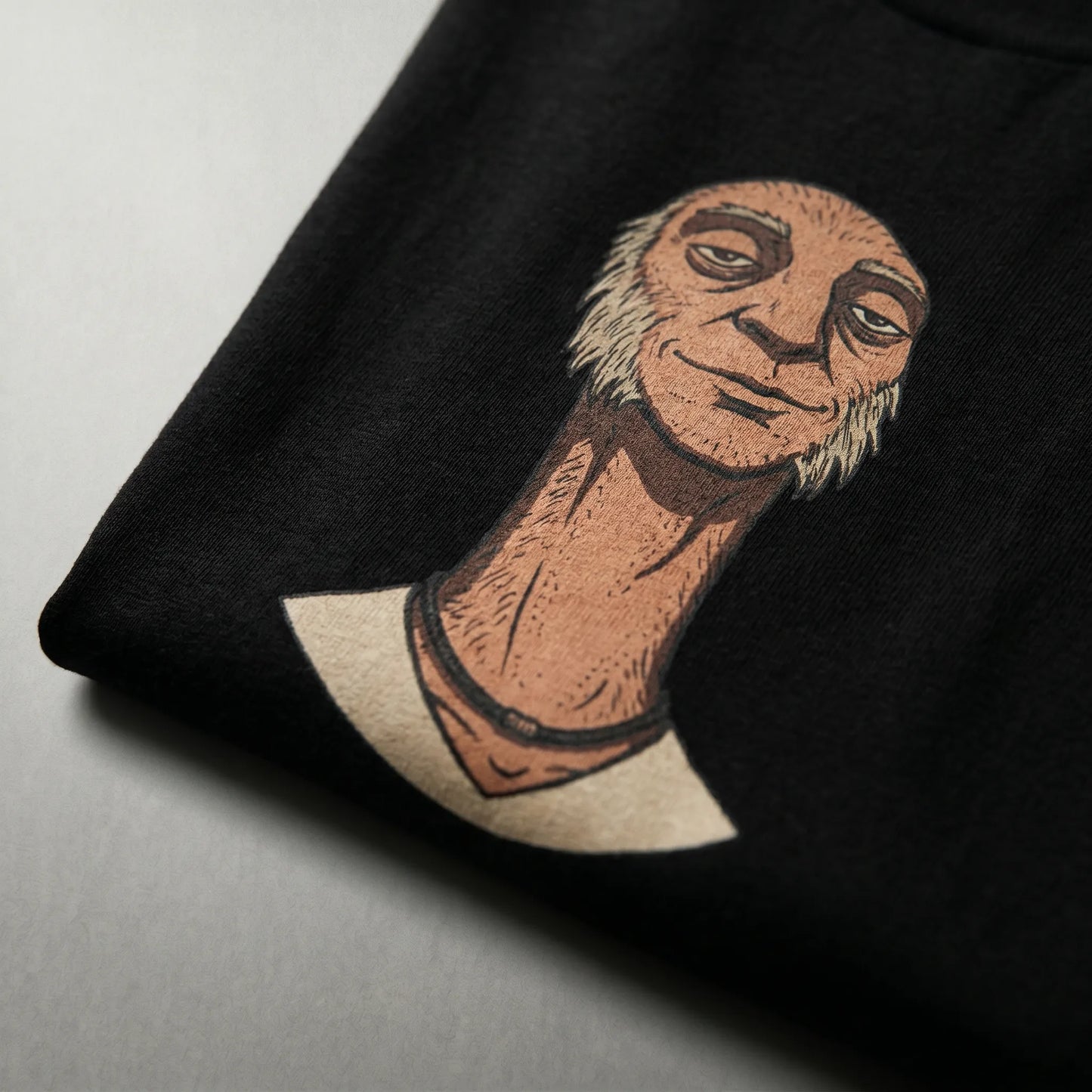 Close-up detail of the soft-hand DTG print on a ringspun 6 oz heavy cotton Skinny Hairy Neck Illusion Tee, highlighting the durable made-to-order fabric that won't crack with wash.