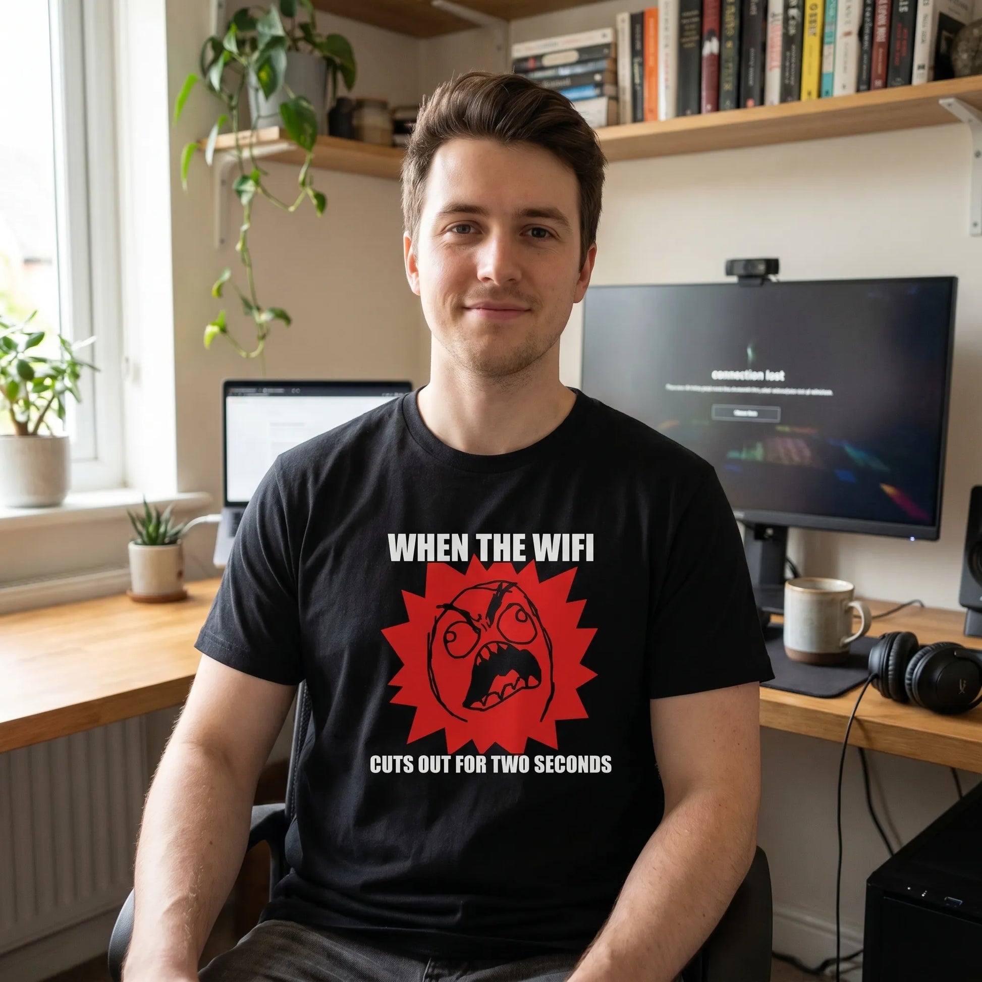 Lifestyle shot of a person wearing a funny Rage Guy meme gift t-shirt featuring the 2008 rage comics face over a red flame-burst with a white Impact caption for a my face when reaction.