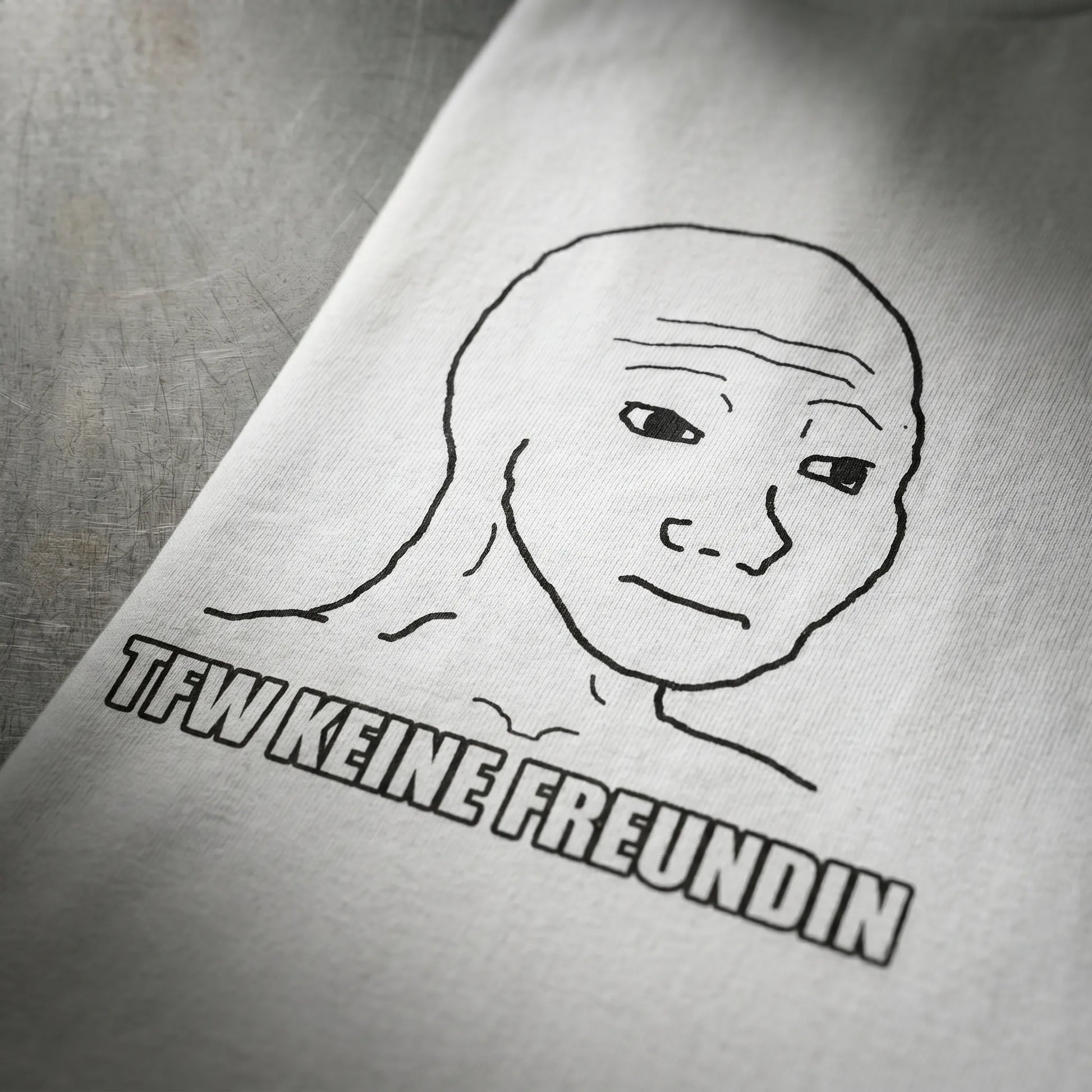 Close-up detail of the Impact meme all-caps caption on this made-to-order frontal bust print, a tfw no gf funny gift and wojak meme gift for him in sizes S-5XL with fast delivery and ships worldwide.