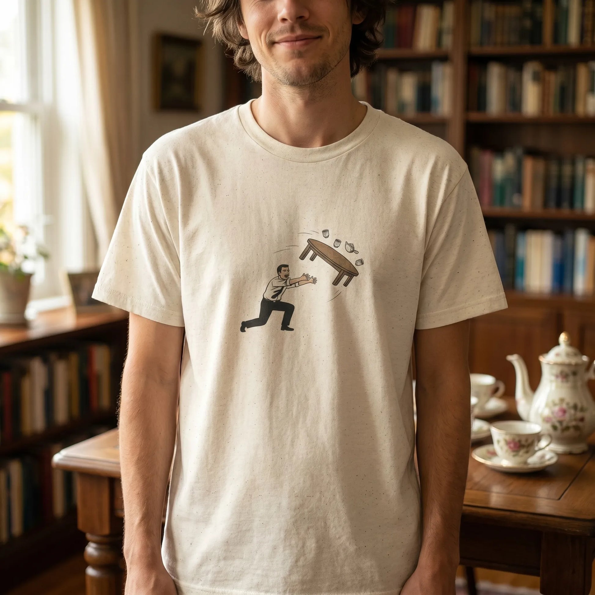 Lifestyle shot of the Table Flip Emoticon Tee, a funny kaomoji shirt for programmers, machine wash cold and tumble dry low, one keystroke away since 2011.