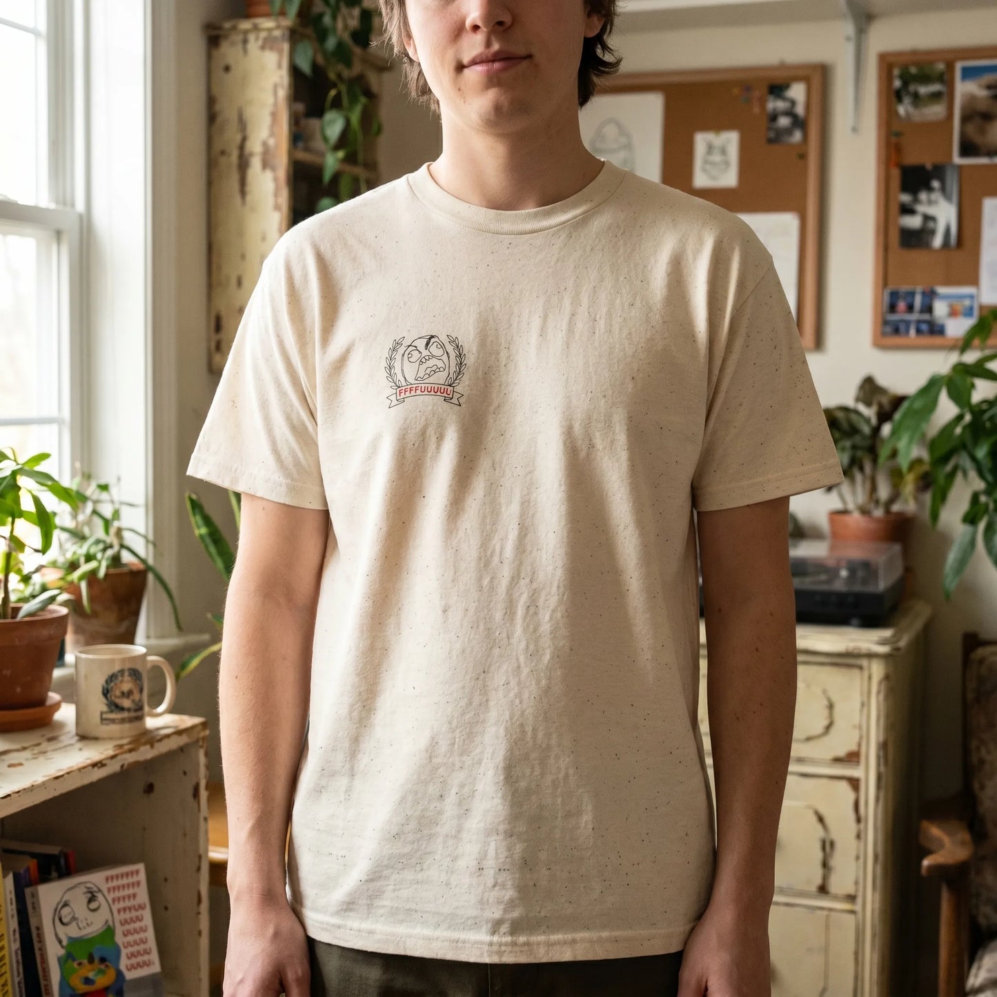 Lifestyle shot of a person wearing an old internet meme shirt featuring a Rage Guy heraldic crest with a red FFFFUUUU banner caption and 2008 rage comics design.