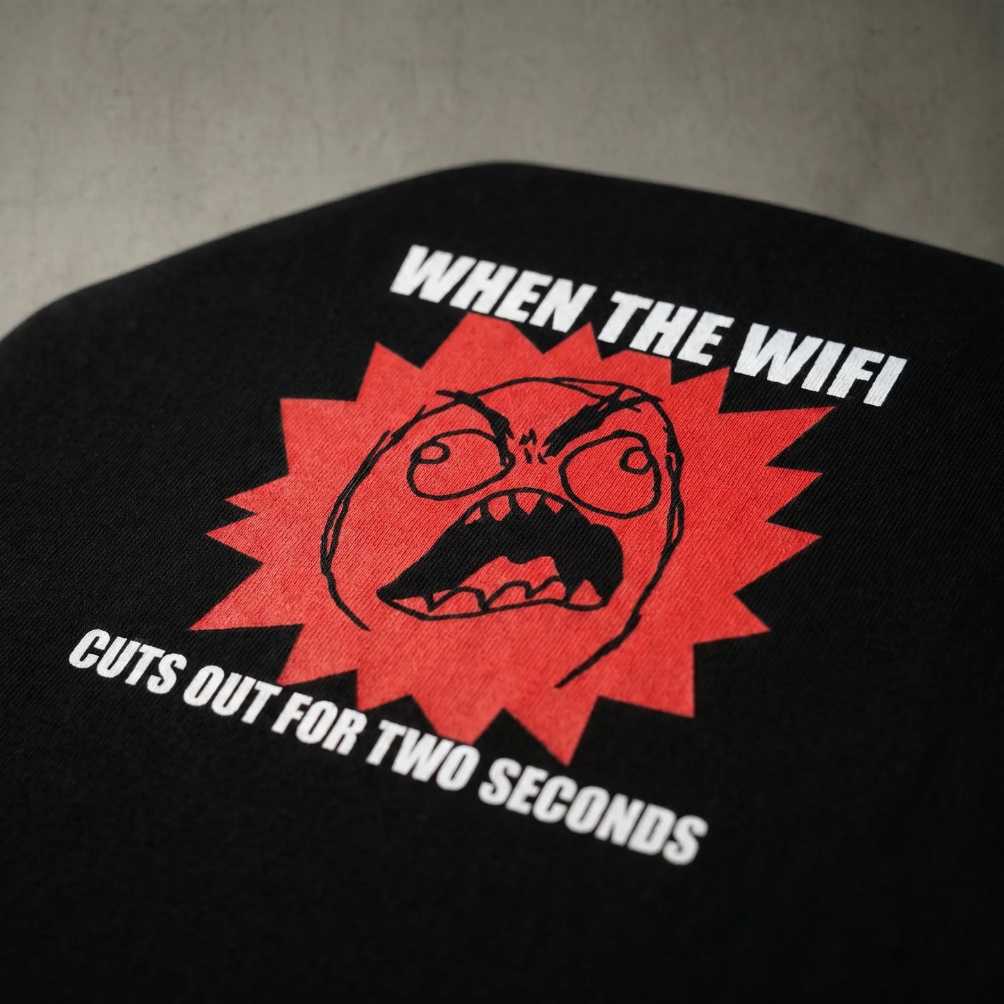 Close-up detail of the high-quality DTG print on a Rage Guy meme tee, showing the soft-hand texture and durable 6.0 oz heavyweight cotton fabric that won't crack.